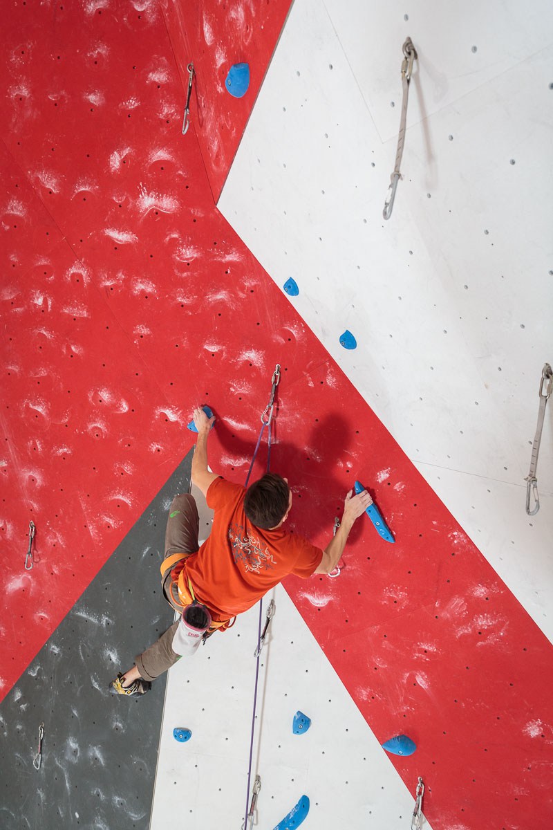 Sauli on a route he set at Oulun Kiipeilykeskus